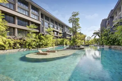 a swimming pool in front of a building at Anagata 3 Tanjung Benoa Bali in Nusa Dua