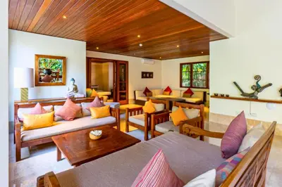 a living room with couches and tables at Magnificent 4 BR Private Pool Villa NE10 in Jimbaran