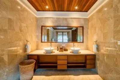 a bathroom with two sinks and a mirror at Majestic 3 BR Private Pool Villa NE18 in Jimbaran