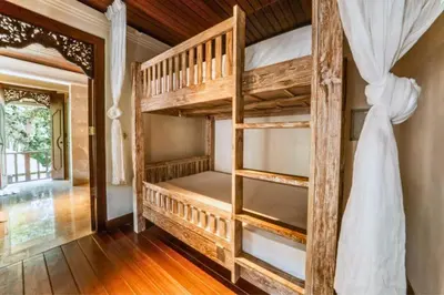 a bedroom with bunk beds in a house at Majestic 3 BR Private Pool Villa NE18 in Jimbaran