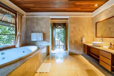 a large bathroom with a tub and a sink at Majestic 3 BR Private Pool Villa NE18 in Jimbaran