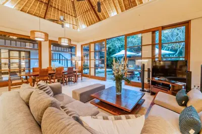 a living room with a couch and a table at Majestic 3 BR Private Pool Villa NE18 in Jimbaran