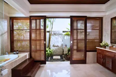 a bathroom with a bath tub and a sink at Mandevilla 4 BR Private Pool Villa NE25 in Jimbaran