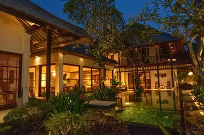 a house with a pool in front of it at Mandevilla 4 BR Private Pool Villa NE25 in Jimbaran