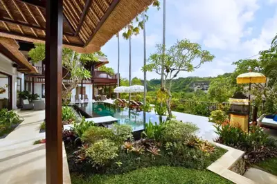 an exterior view of a resort with a swimming pool at Mandevilla 4 BR Private Pool Villa NE25 in Jimbaran