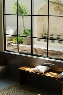 a window in a room with a wooden table at LUX Casa Amore 4BR pick up from airport security PlayStation and Netflix in Seminyak