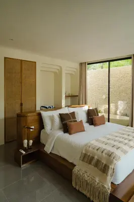 a bedroom with a large bed and a large window at LUX Casa Amore 4BR pick up from airport security PlayStation and Netflix in Seminyak