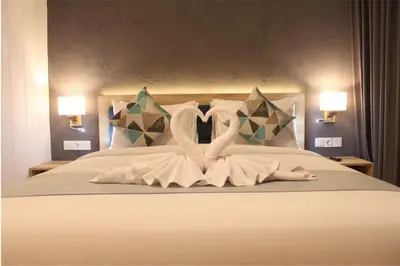 a bed with two swans made out of towels at Anagata 2 Tanjung Benoa Bali in Nusa Dua