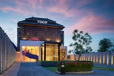 a building with a vogo sign on the side of it at voco Bali Seminyak by IHG in Seminyak