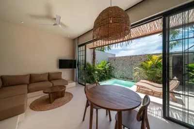a living room with a couch and a table at Casa Melosa 1 - Romantic and Cozy 1BR Villa in the Heart of Umalas in Canggu