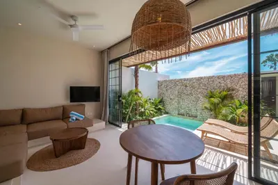 a living room with a couch and a table at Casa Melosa 2 : Charming and Intimate 1BR Villa Nestled in Umalas in Canggu
