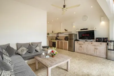 a living room with a couch and a table at 3 Bedroom cozy private pool Villa in Seminyak WIFI in Seminyak