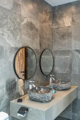 two sinks in a bathroom with two mirrors at Villa Koya : Luxurious and Modern 3BR Villa in Seminyak! in Seminyak
