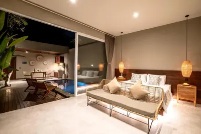 a living room with a couch and a table at Damarya Villa Canggu in Canggu