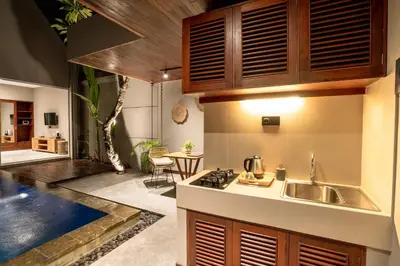 a kitchen with a sink and a counter top at Damarya Villa Canggu in Canggu