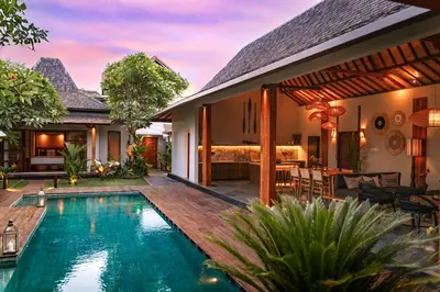a villa with a swimming pool and a house at Villa Zarrin Seminyak Bali Luxury 3 bedroom villa in Seminyak