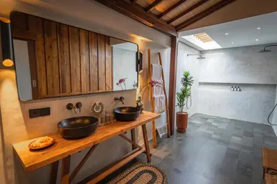 a bathroom with two sinks on a wooden counter at Villa Zarrin Seminyak Bali Luxury 3 bedroom villa in Seminyak