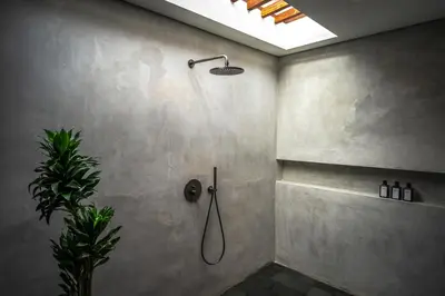 a bathroom with a shower with a shower head at Villa Zarrin Seminyak Bali Luxury 3 bedroom villa in Seminyak