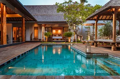 a swimming pool in front of a villa at Villa Zarrin Seminyak Bali Luxury 3 bedroom villa in Seminyak