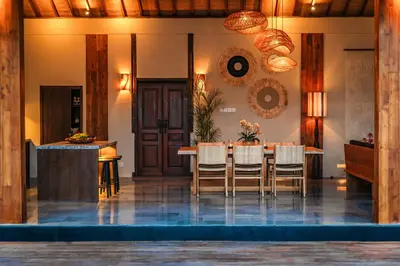 a dining room with a table and chairs at Villa Zarrin Seminyak Bali Luxury 3 bedroom villa in Seminyak