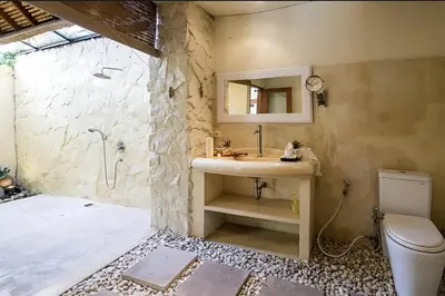 a bathroom with a sink and a shower at Villa Umah Maya 3BR Seminyak in Seminyak
