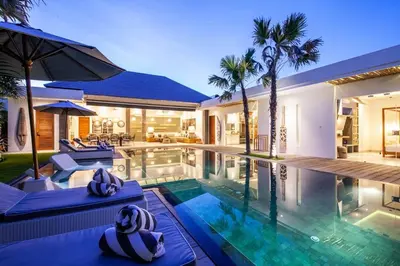 a villa with a swimming pool and a house at Spectacular 4BR Villa, 400m to Beachfront Bliss in Canggu