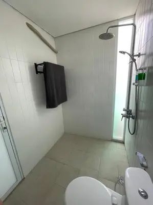 a bathroom with a shower and a toilet and a sink at Monty’s Villa Umalas - 1 Bedroom in Kerobokan