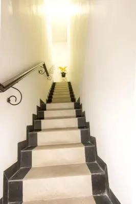 a stairway with a stair case in a building at Villa cinta buana 1 in Legian