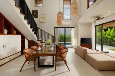 a living room with a table and a couch at Villa Ananya Seminyak by Nakula in Seminyak