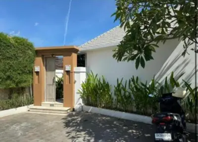 a motorcycle parked in front of a house at Beautiful villa Yang Tao in the heart of Seminyak with private staff in Seminyak