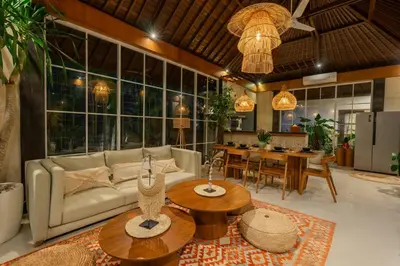 a living room with a couch and a table at Villa Nana by Pertama Management in Seminyak