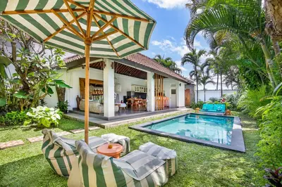 an external view of a villa with a swimming pool at Villa Anouk in Seminyak