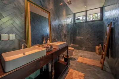 a bathroom with a sink and a mirror at Casa Madi Canggu in Canggu