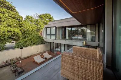 an external view of a house with a balcony at Casa Madi Canggu in Canggu