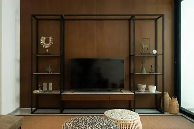a living room with a large flat screen tv at Villa Talisman - Stylish Canggu with Rooftop Villa 5 mins to Beach in Canggu