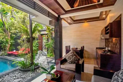 an outdoor living room with a pool in a house at Bramanty 2 BR Private Pool Villa in Seminyak