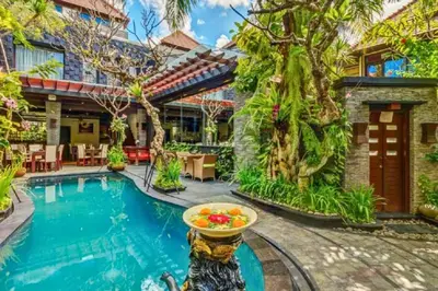 a home with a swimming pool and a house at Bramanty 2 BR Private Pool Villa in Seminyak