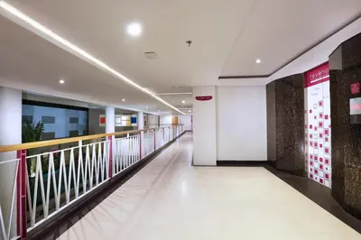 a corridor in a building with a corridor gmaxwell gmaxwell gmaxwell gmaxwell gmaxwell at favehotel Sunset Seminyak in Seminyak