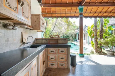 a kitchen with a sink and a counter top at Villa Anais Seminyak in Seminyak