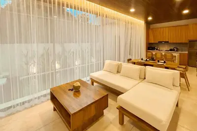 a living room with a couch and a table at Villa Prada II 3BR Villa Near to Beach in Seminyak in Seminyak