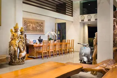 a dining room with a table and chairs at Vadjar 1 BR Private Pool Villa in Seminyak