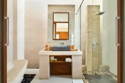 a bathroom with a sink and a shower with a mirror at Zefanya 2 BR Private Pool Villa in Seminyak