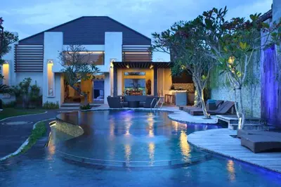 a swimming pool in the yard of a house at Zefanya 2 BR Private Pool Villa in Seminyak