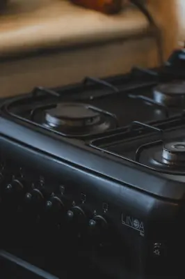 a close up of a black stove top oven at Taman pangeran villa in Seminyak, 2BR large pool, Prime Location ! in Seminyak