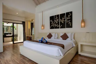 a bedroom with a large white bed in a room at Anakula 1 - Modern 2 BR Villa, Seminyak in Seminyak