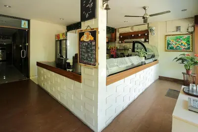 a fast food counter in a restaurant with a counter at Tuban Torres Accommodation in Kuta