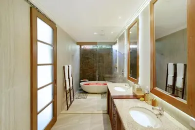 a bathroom with two sinks and a bath tub at Luxury 3BR Private Pool Villa in Seminyak