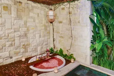 a bathroom with a bath tub in the corner at Beautiful 1BR Private Pool Villa in Seminyak
