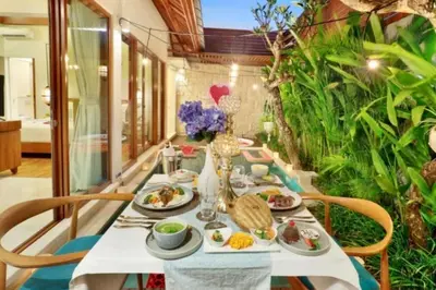 a table with food on it in a room with plants at Beautiful 1BR Private Pool Villa in Seminyak