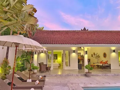 a villa with a swimming pool and a house at Fully renovated villa 3BR in Seminyak - Oberoi in Seminyak